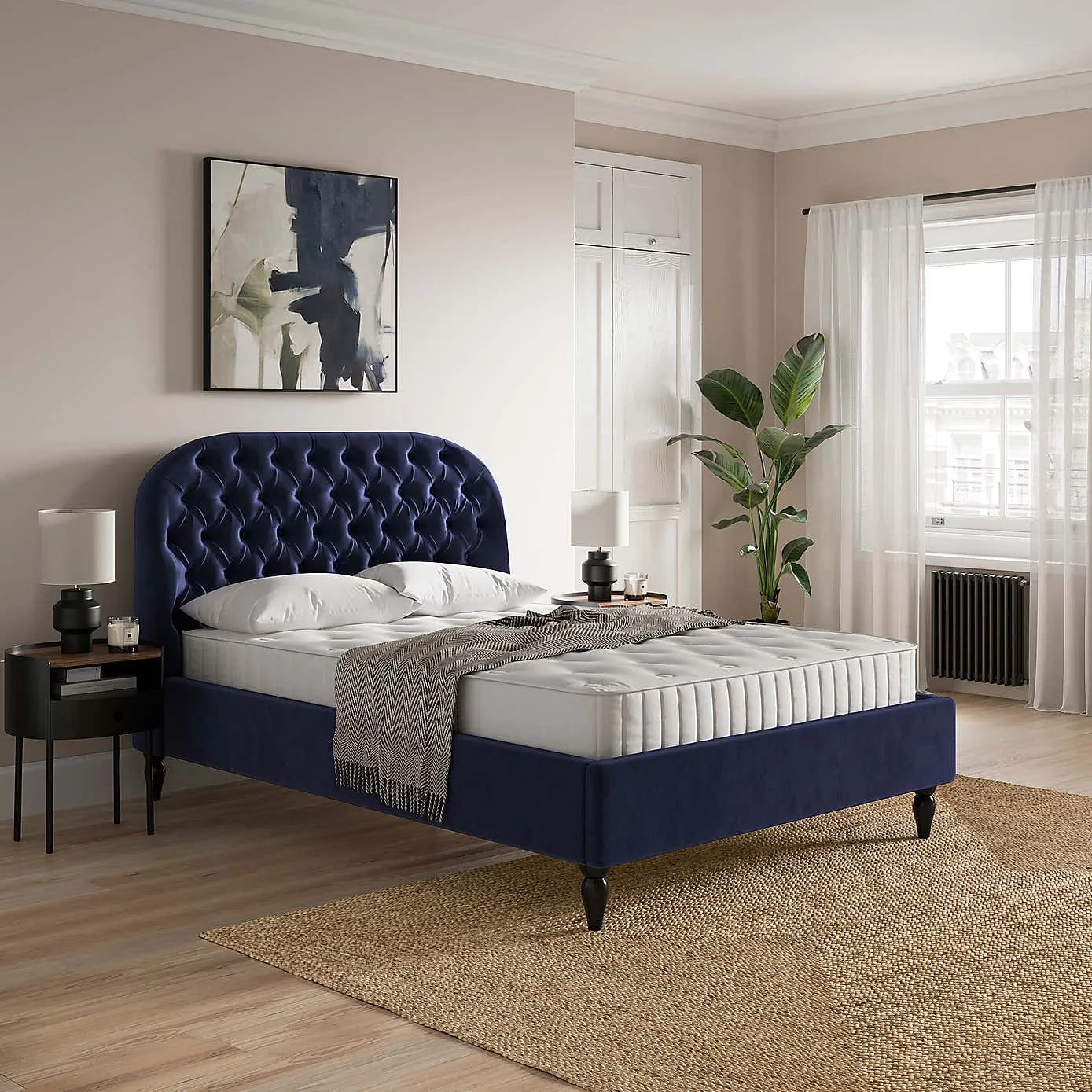 Navy fabric upholstered bed with buttoned headboard