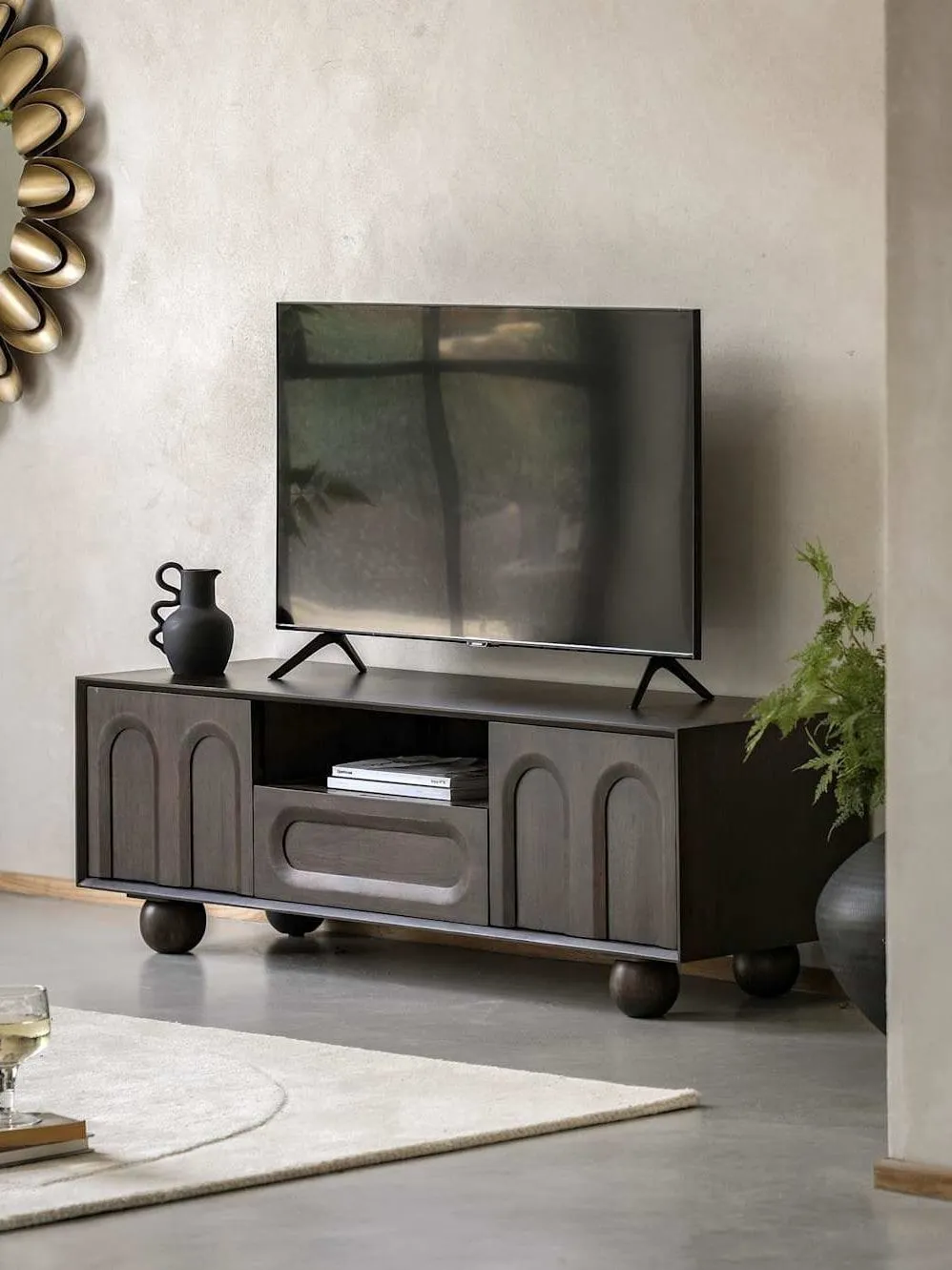 Dark mango tv stand with two arc pattern doors