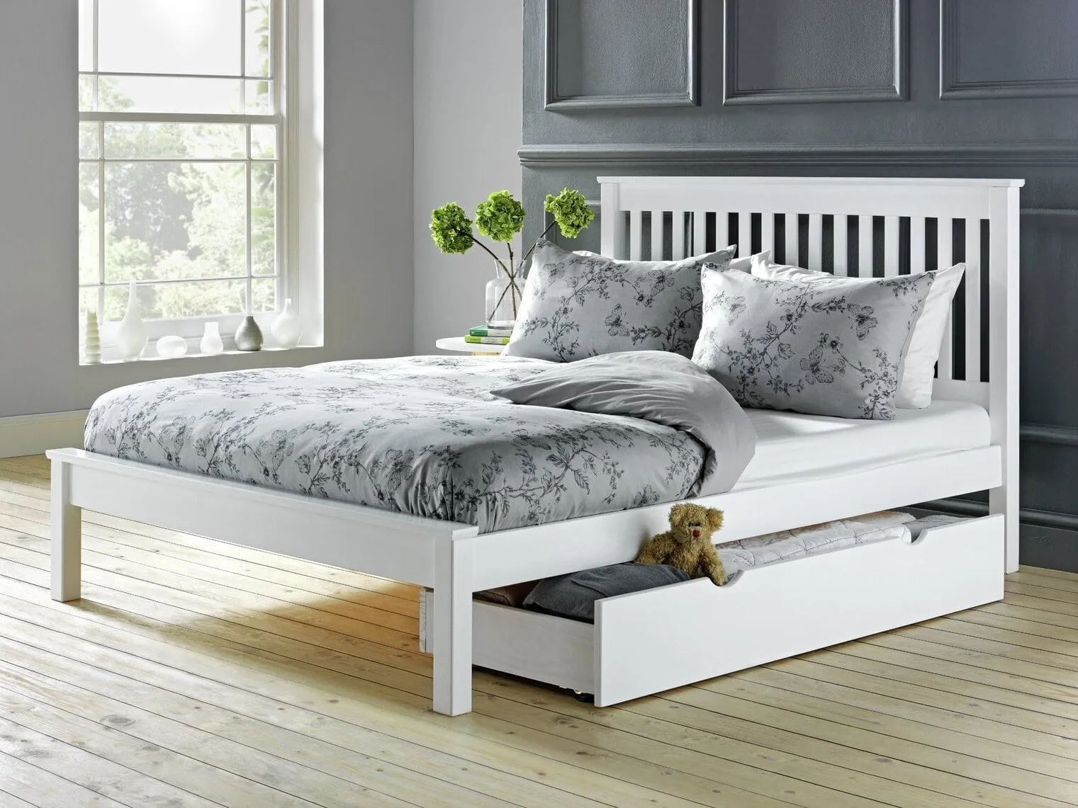 White-painted bed frame with slatted headboard and underbed drawer