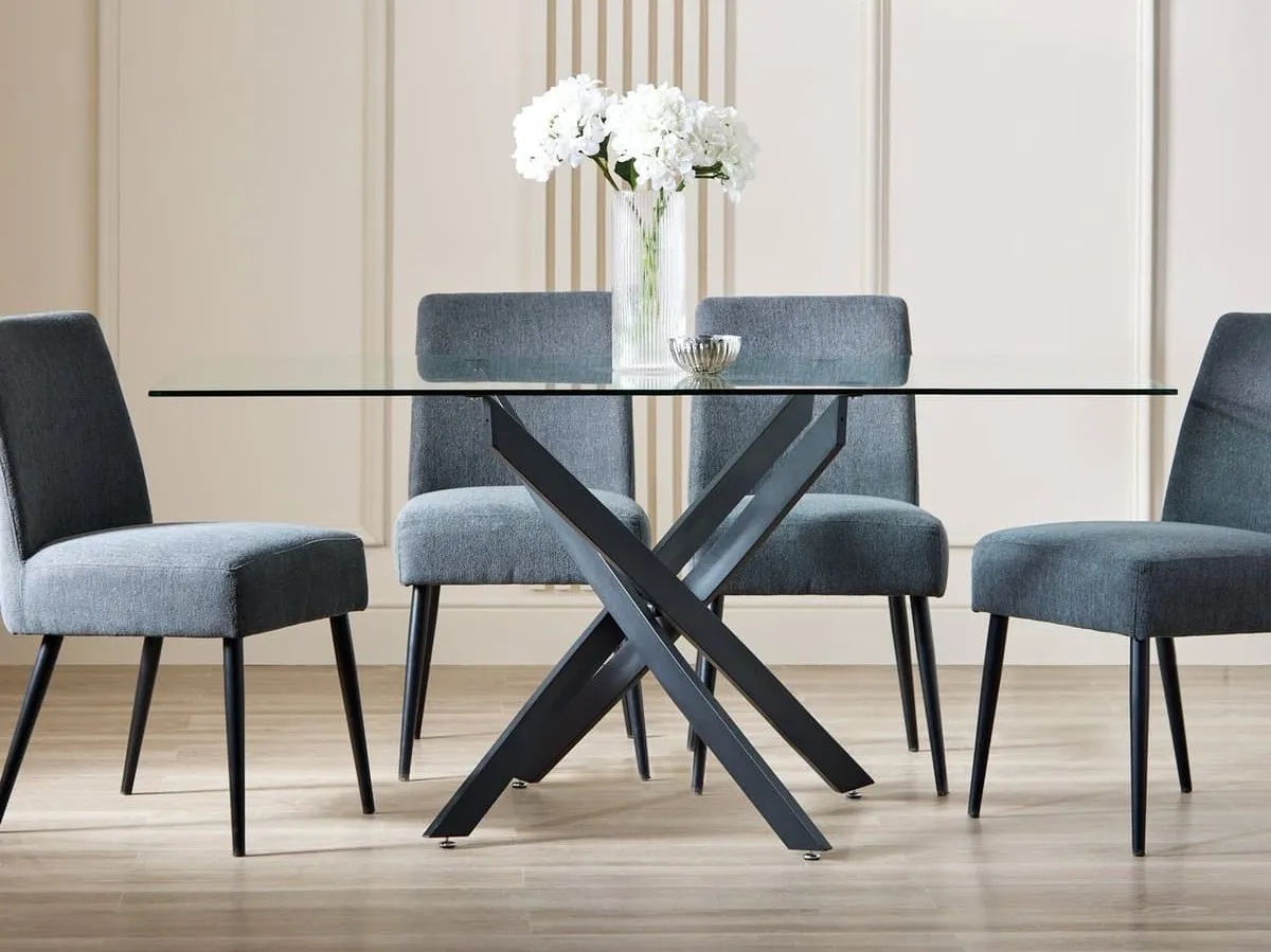 Rextangular glass dining table with sculptured black metal base