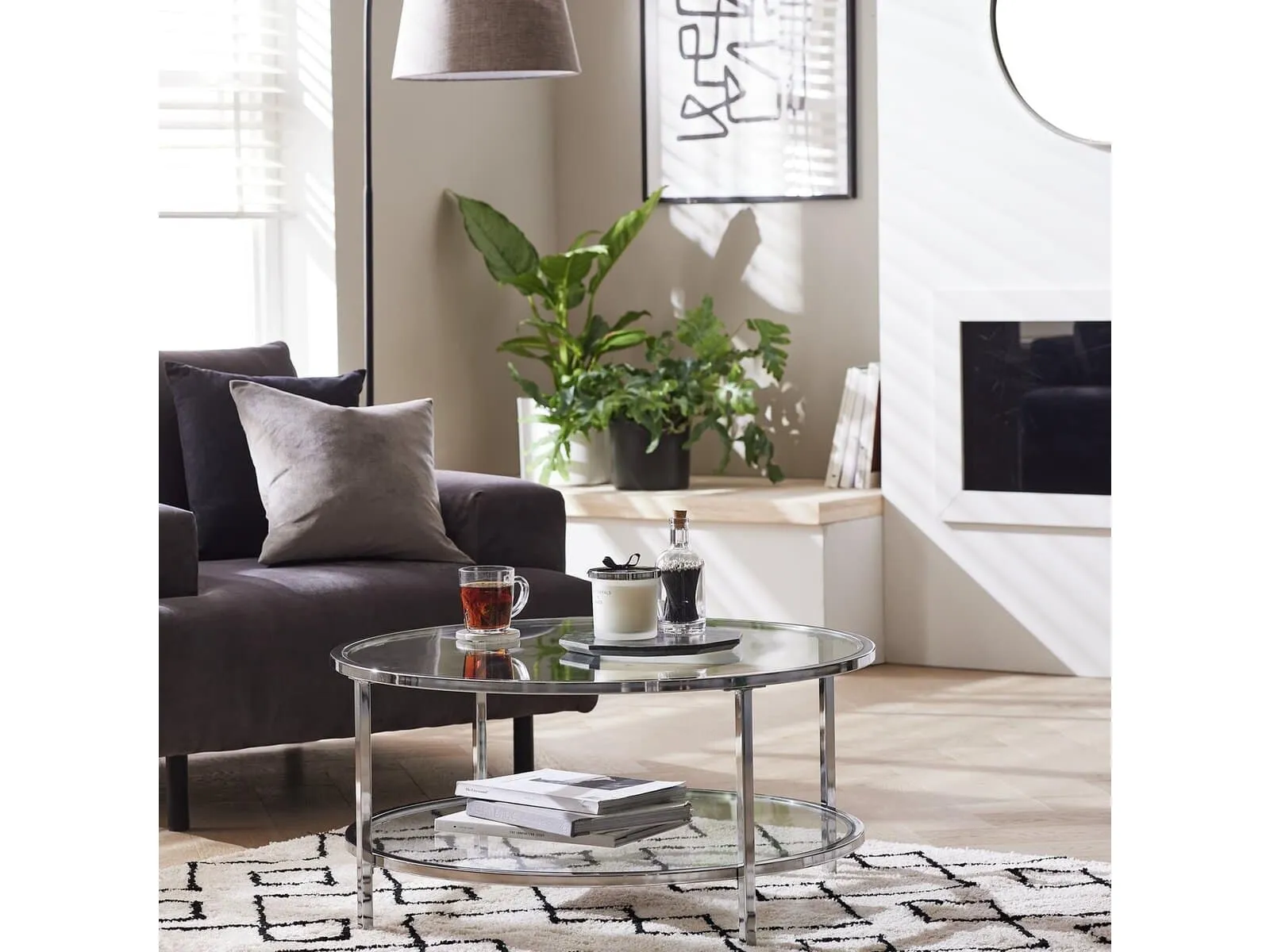 Round glass coffee table with silver frames