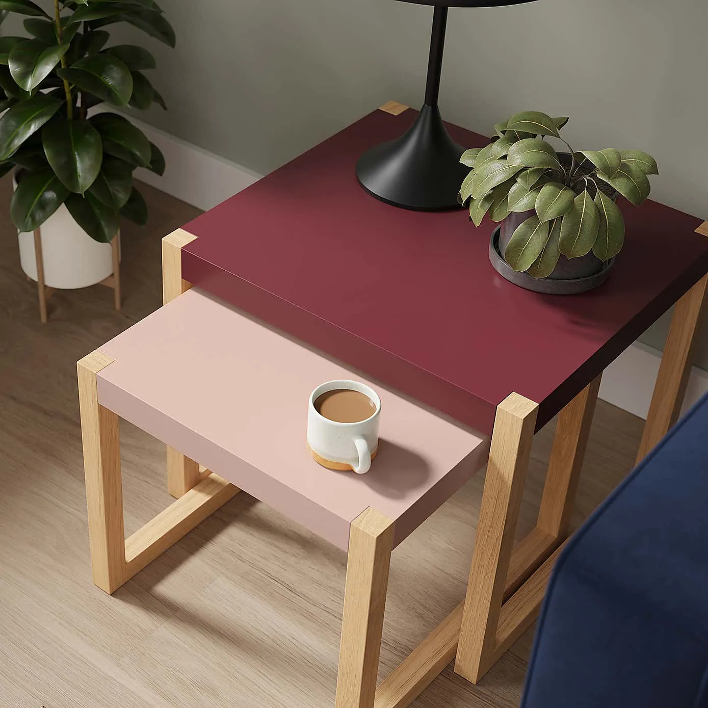 Pair of side tables with a two-tone burgundy/pink finish
