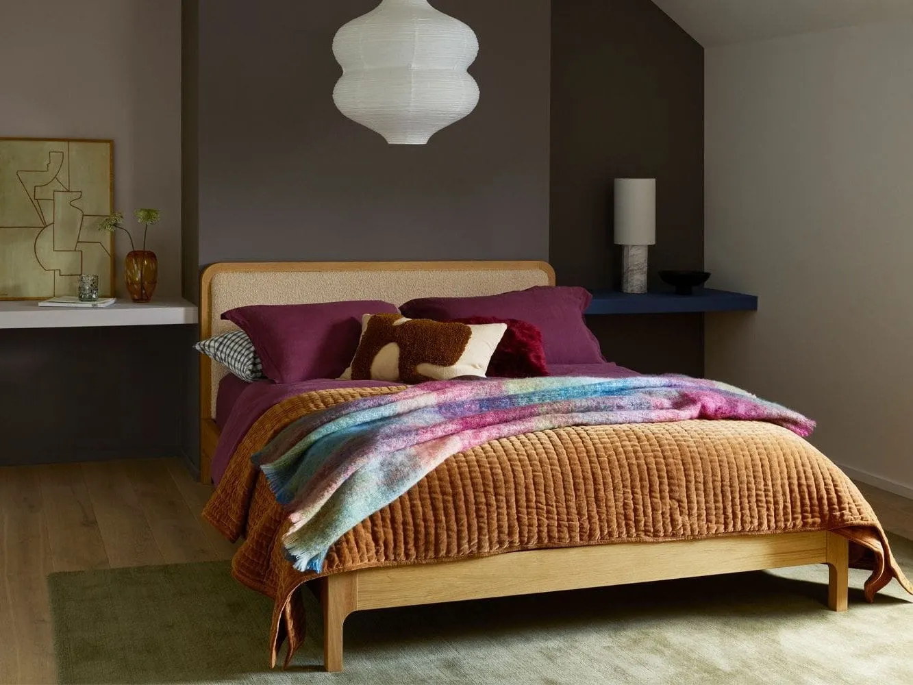 Oak bed with upholstered headboard