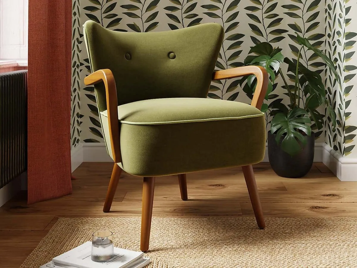 Green fabric armchair with dark wood legs and armrests
