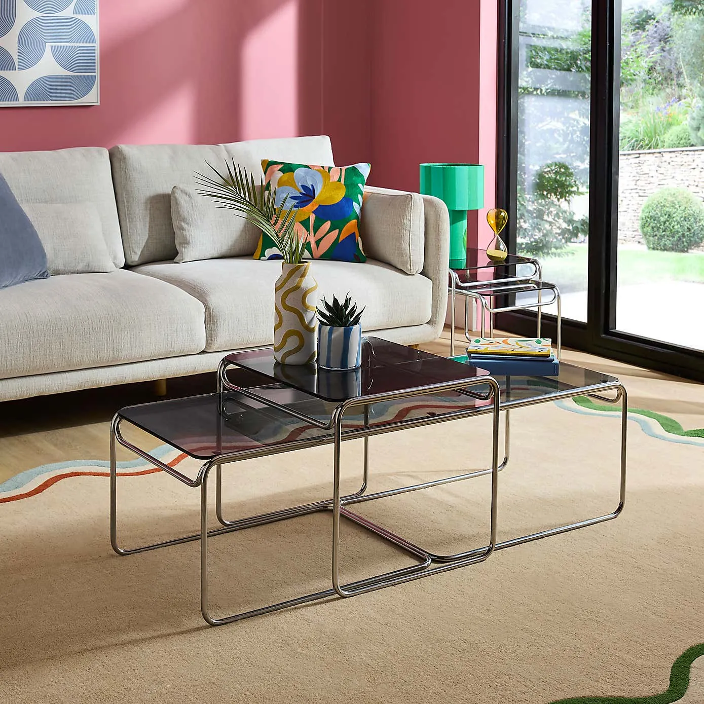 Chrome and glass nest of coffee tables