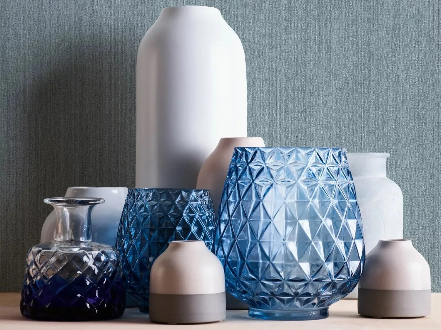 Blue/grey wallpaper with fine textured vertical stripes