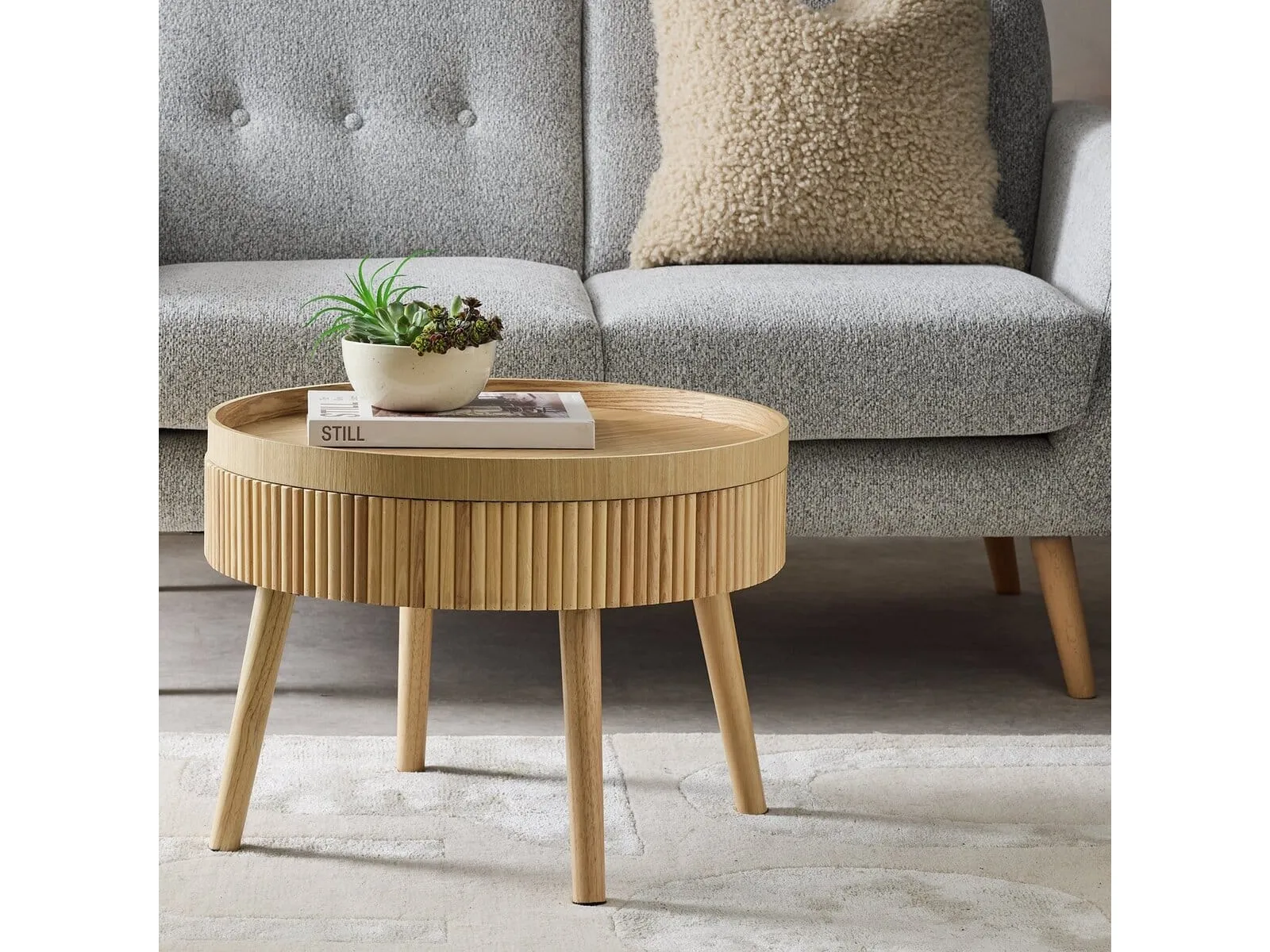 Round oak coffee table with ribbed surround