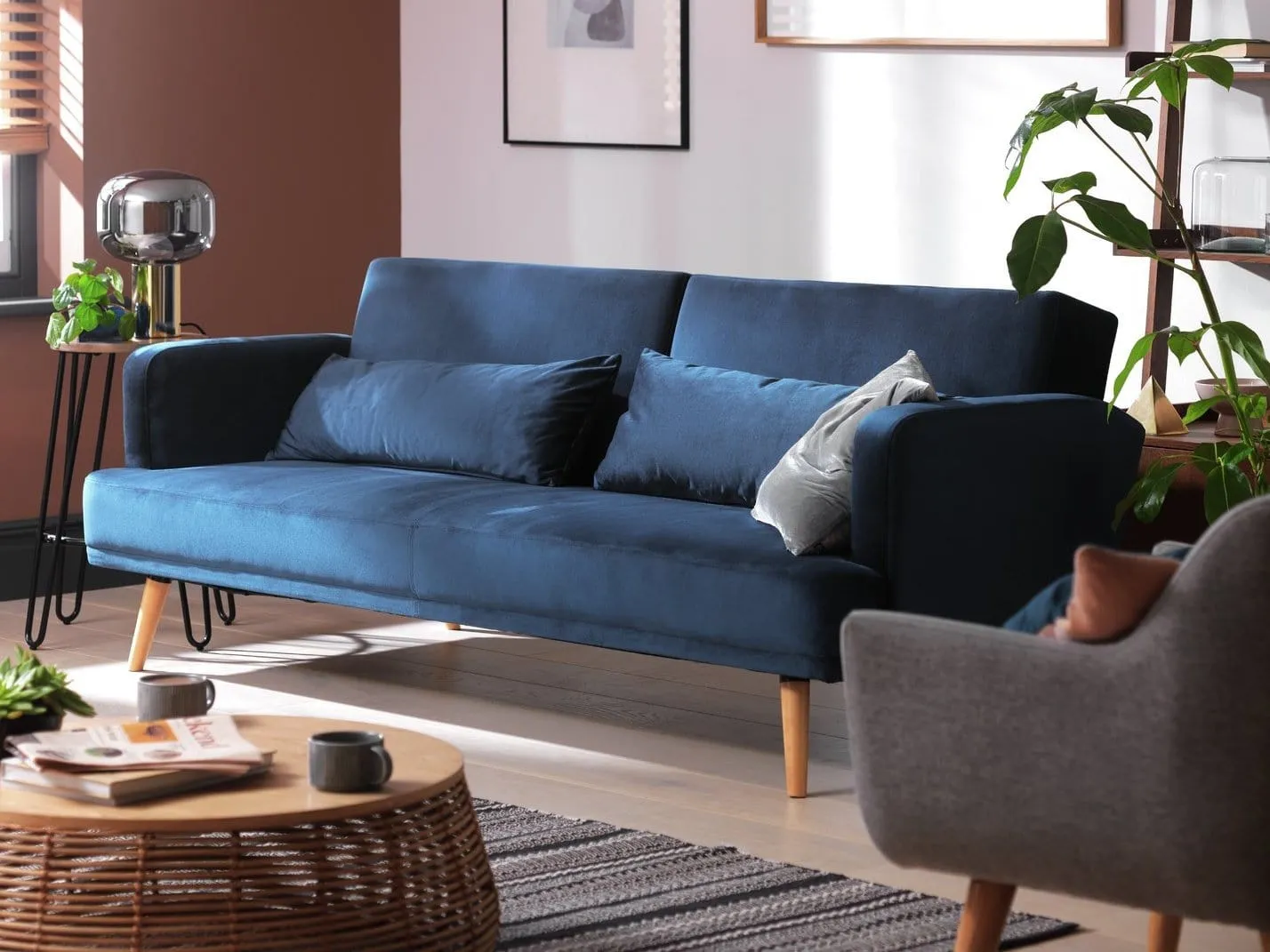 Navy fabric upholstered sofa bed