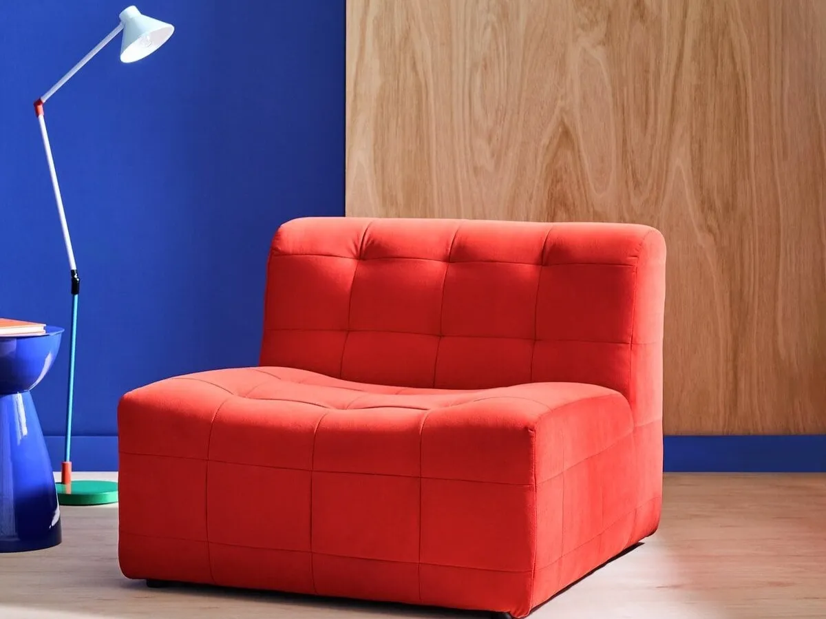 Red velvet upholstered lounge chair