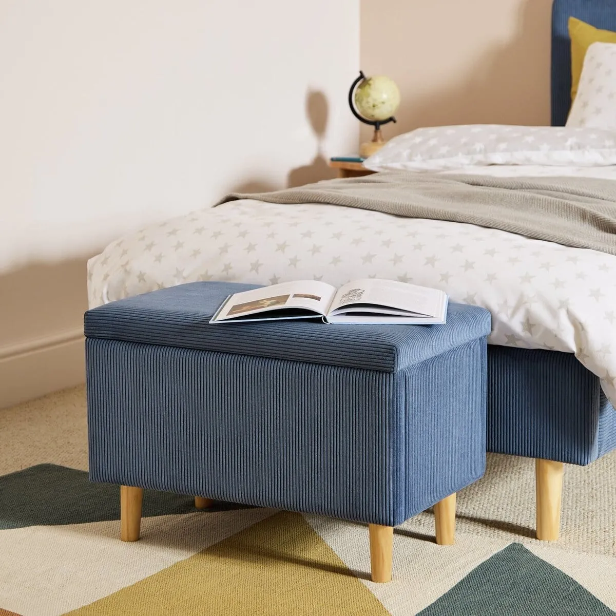 Blue cord fabric upholstered ottoman