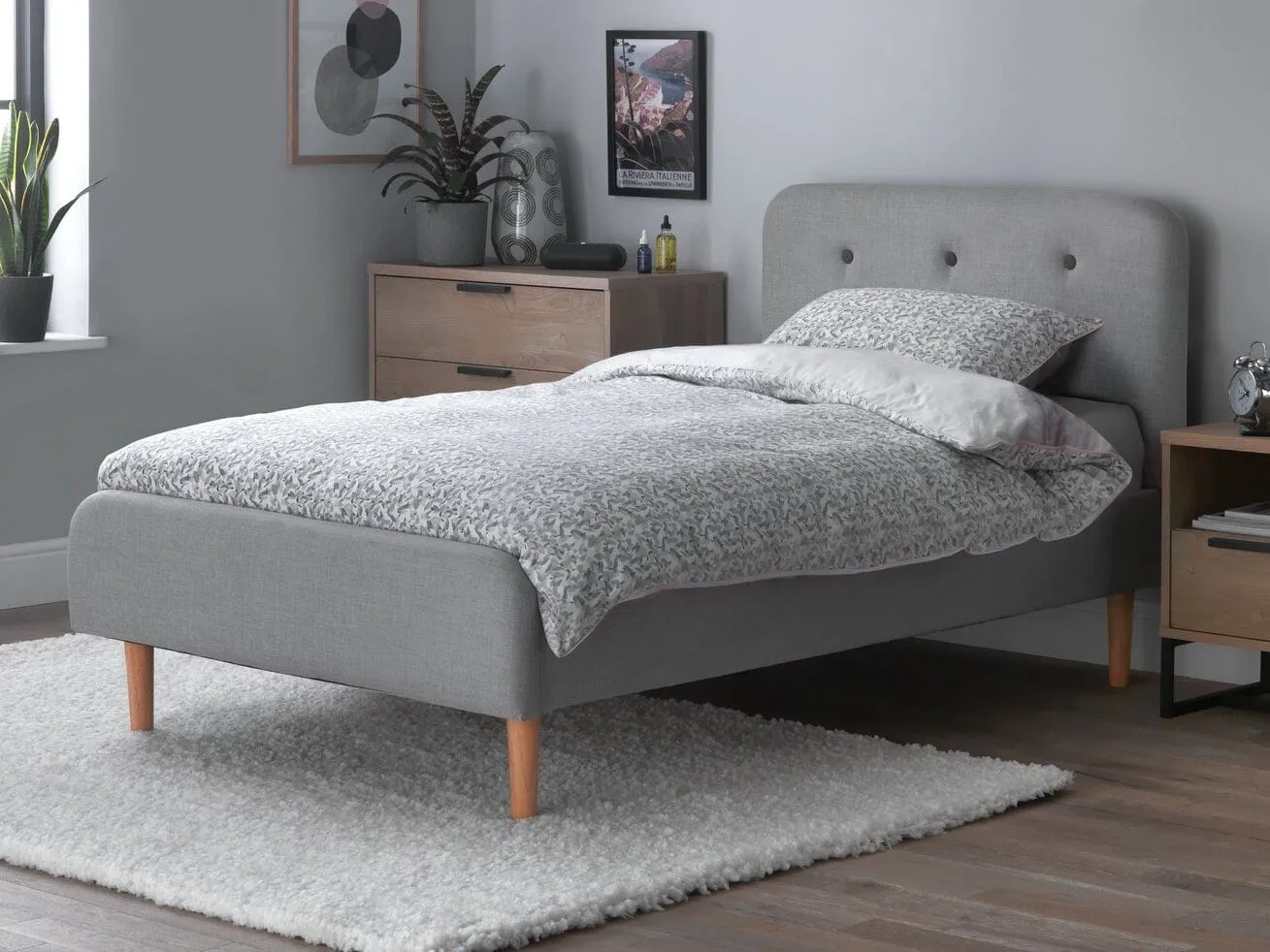 Grey fabric upholstered single bed