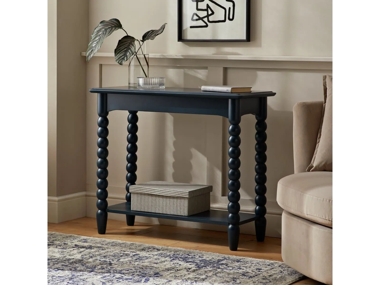 Navy console table with bobbin legs