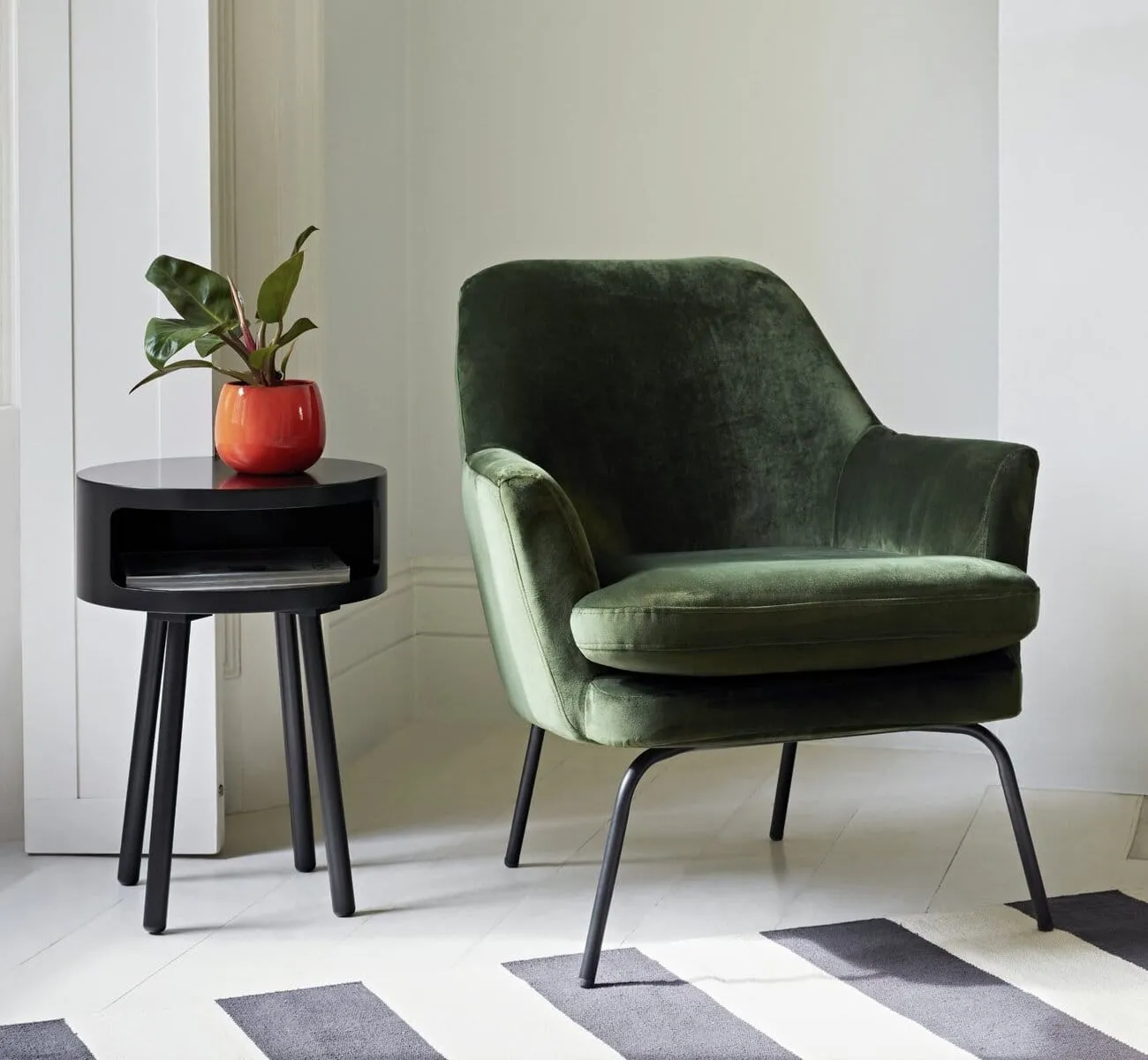 Green velvet upholstered chair