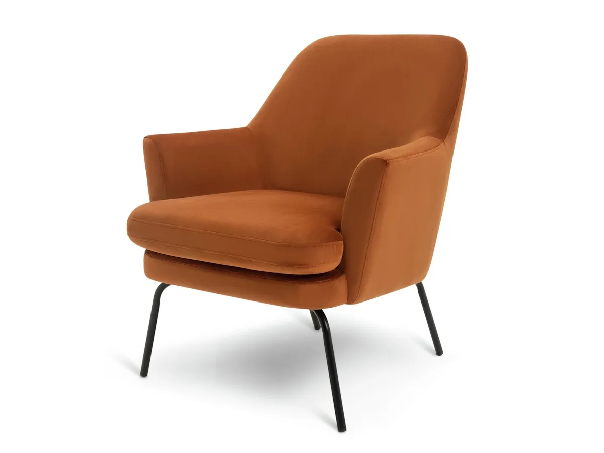 Orange velvet chair with black metal legs