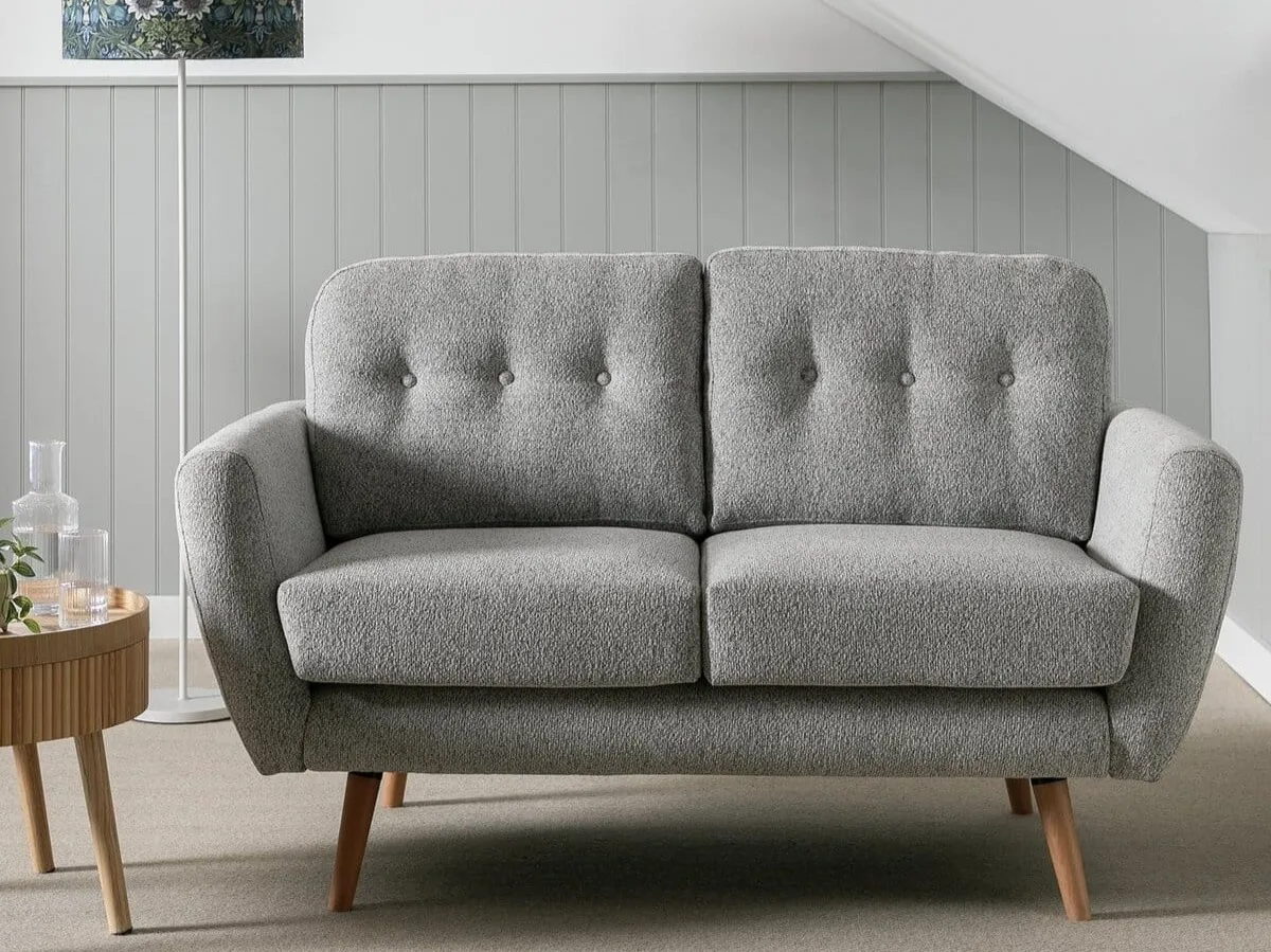 Grey fabric button back sofa with tapered wooden legs