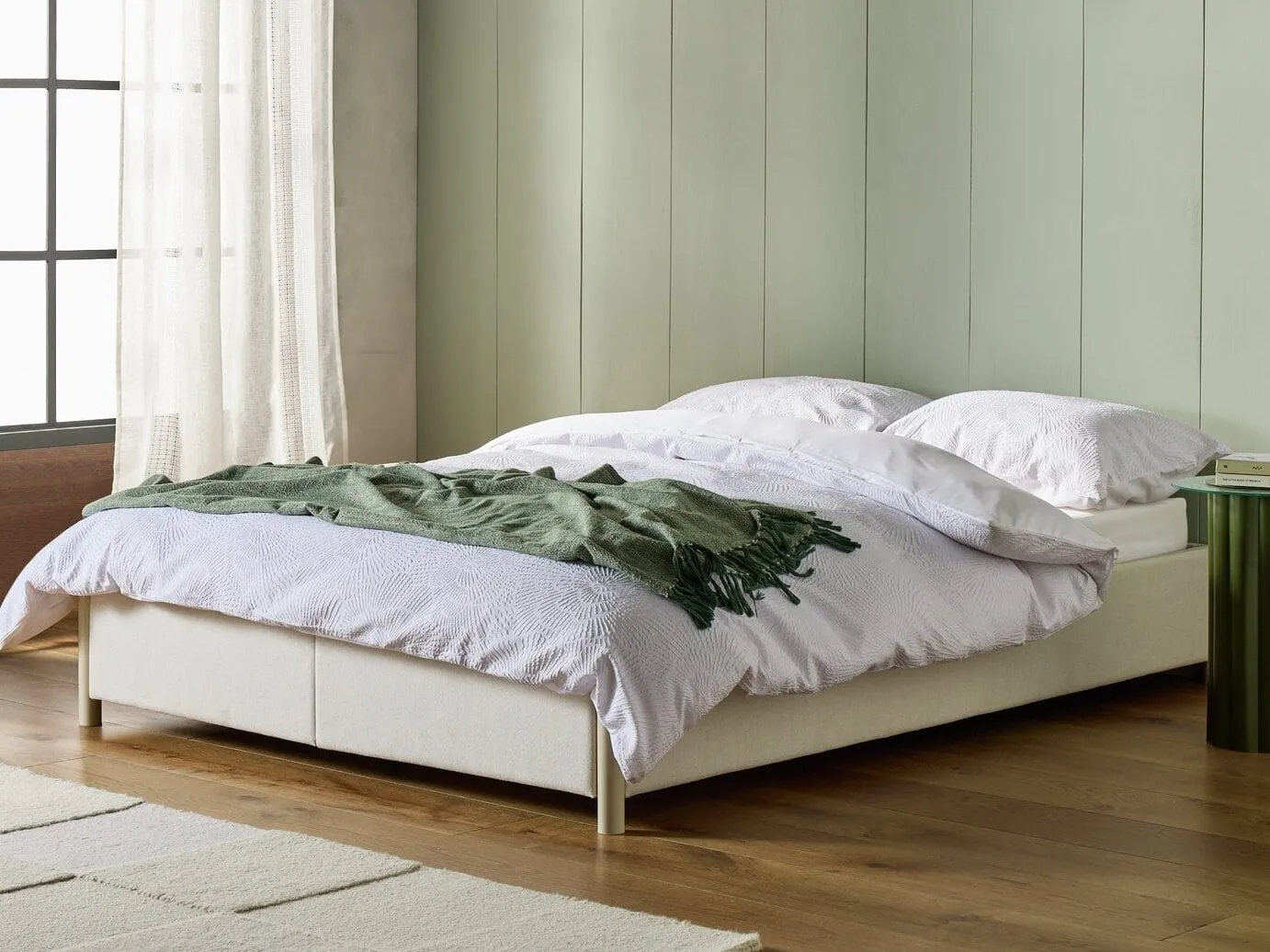 Beige fabric upholstered platform bed