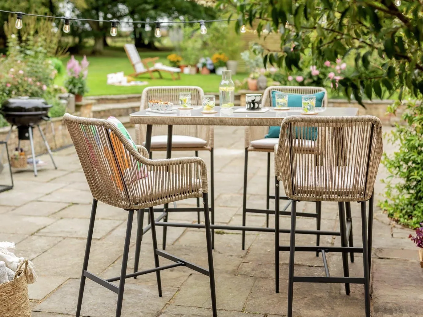 Rattan bar table and 4 bar chairs