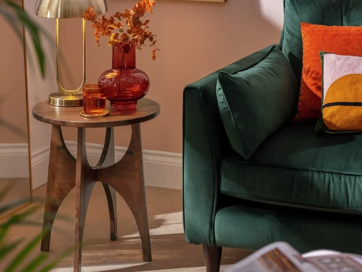 Mid-Century style round side table with walnut finish