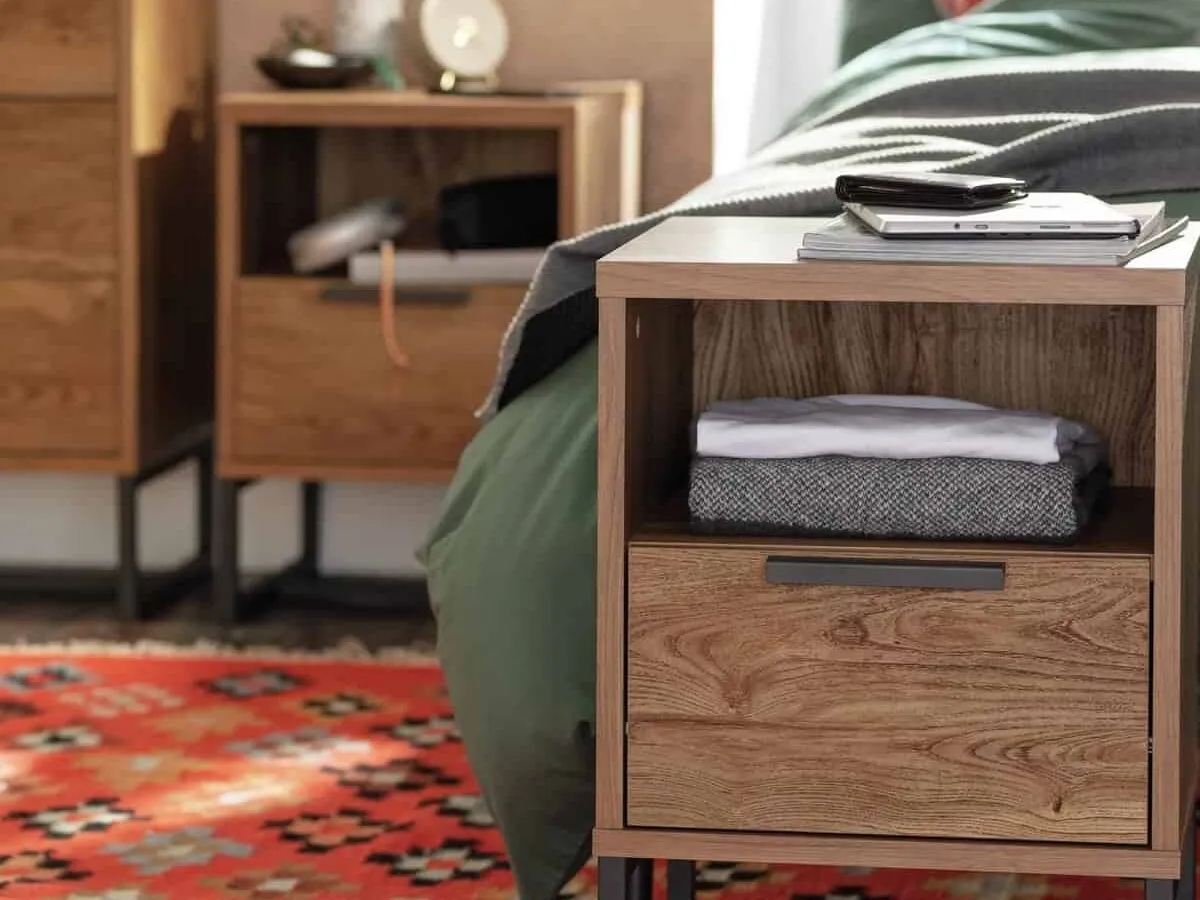 Dark oak bedside table with open shelf and single drawer