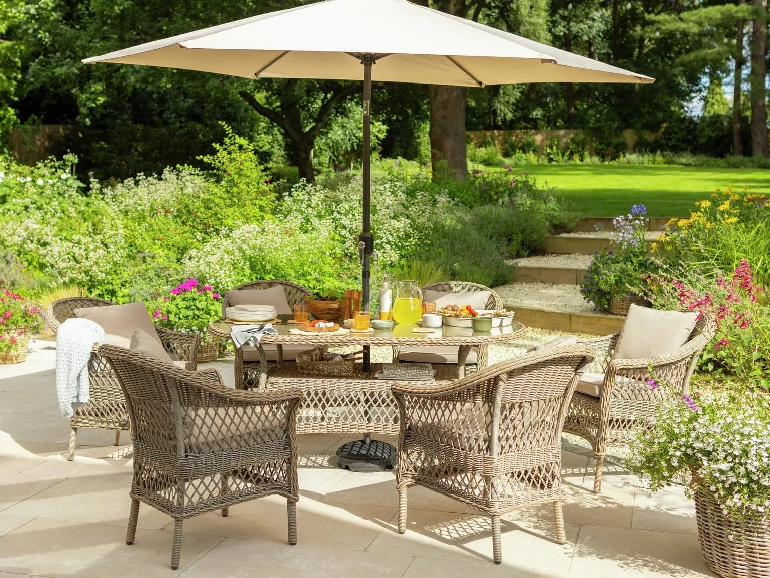 Rattan outdoor dining set with parasol