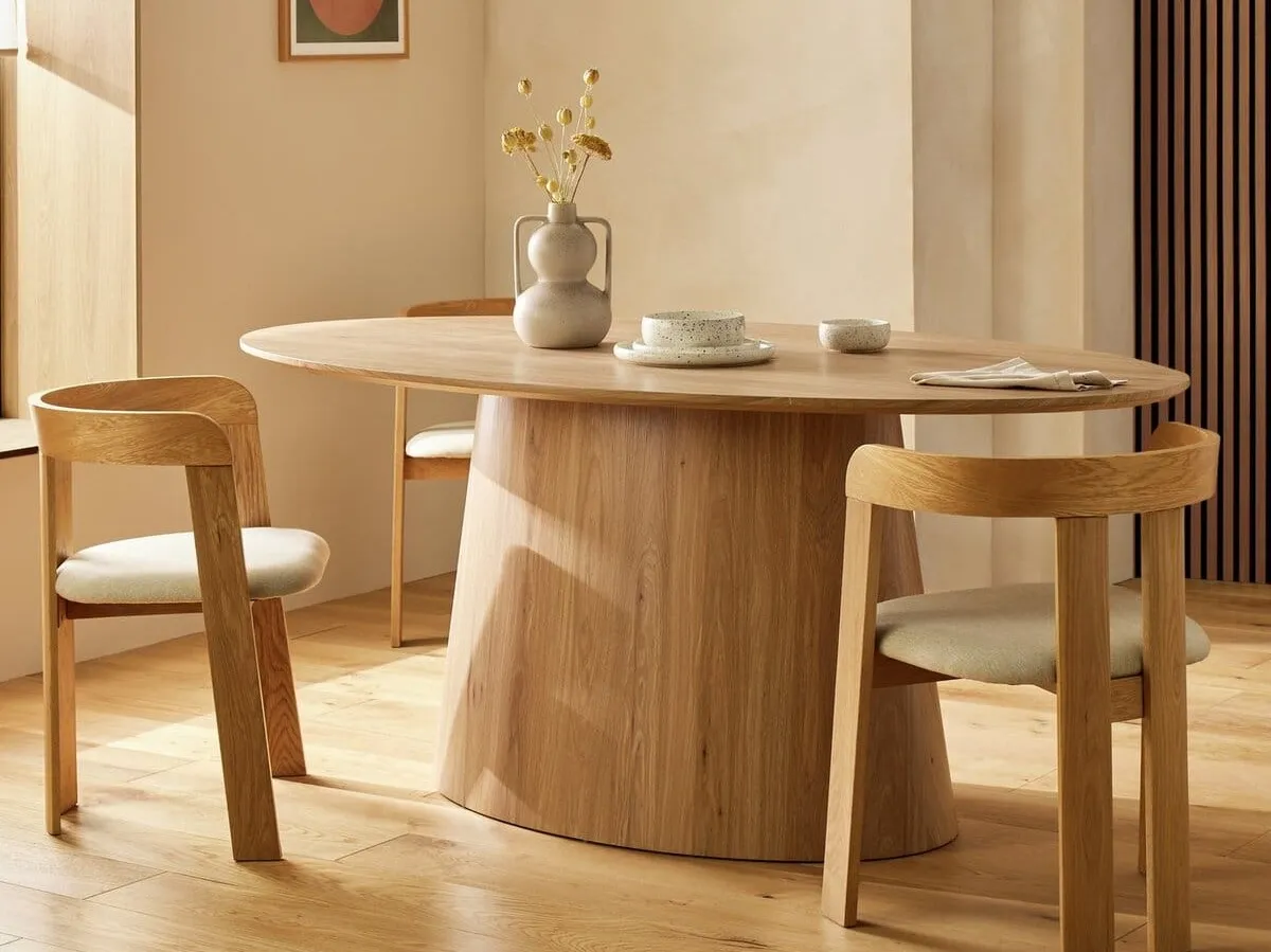 Contemporary oak finish dining table with oval pedestal base