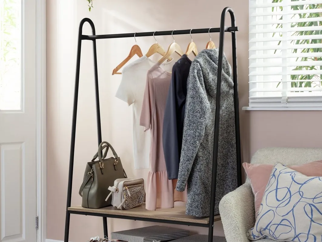 Black metal clothes rail with oak shelf