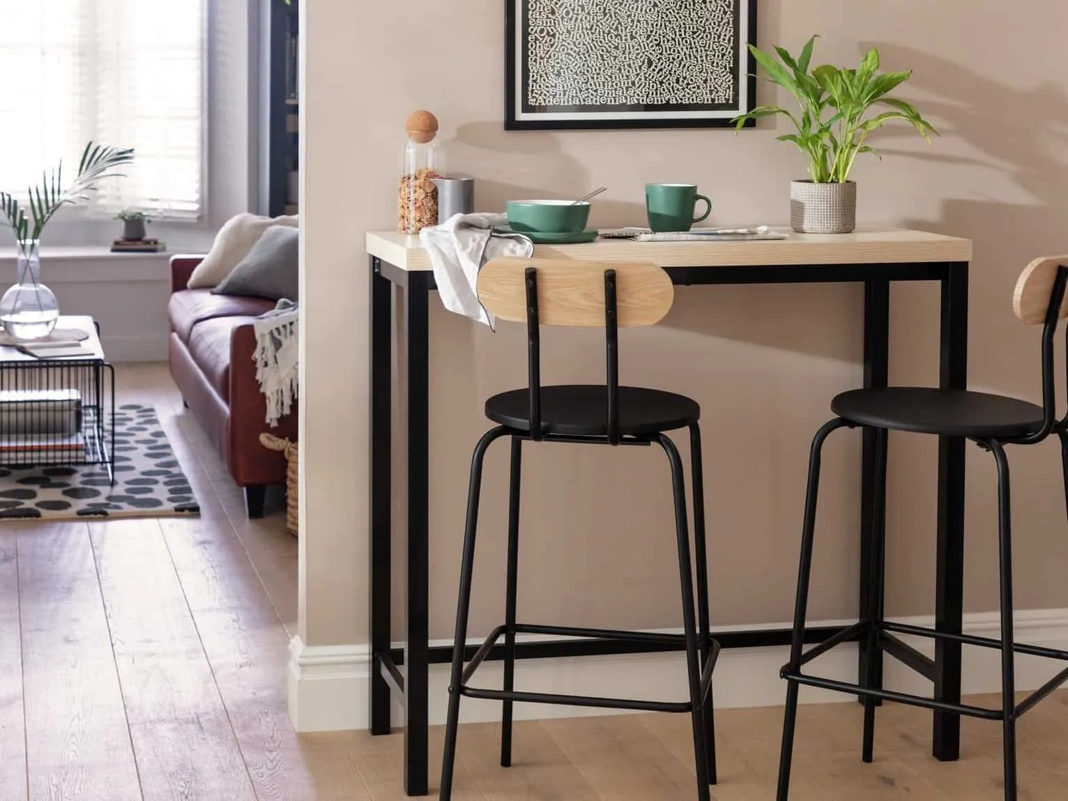 Black frame bar table with wood-effect top and two matching bar chairs