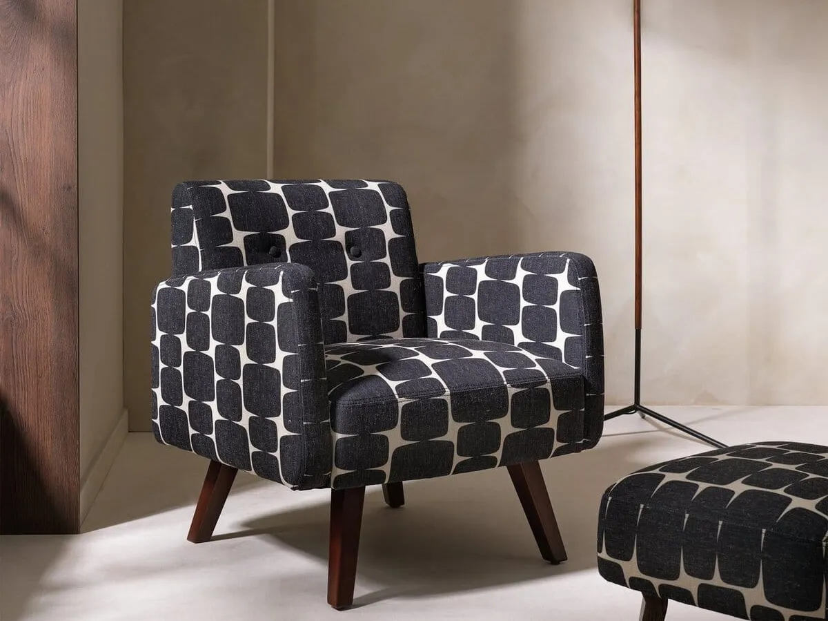 Mid Century style armchair with walnut legs and bold black/white pattern priint fabric upholstery