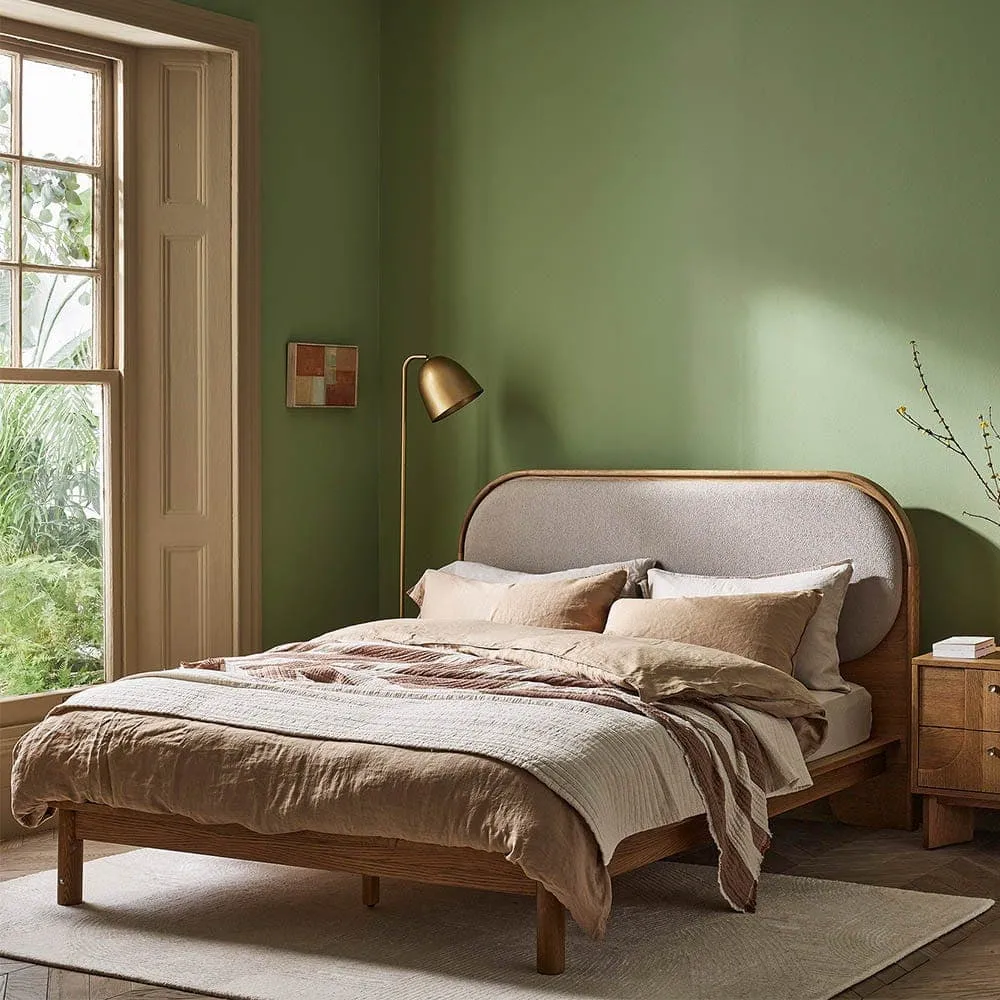 Wooden bed frame with curved fabric upholstered headboard