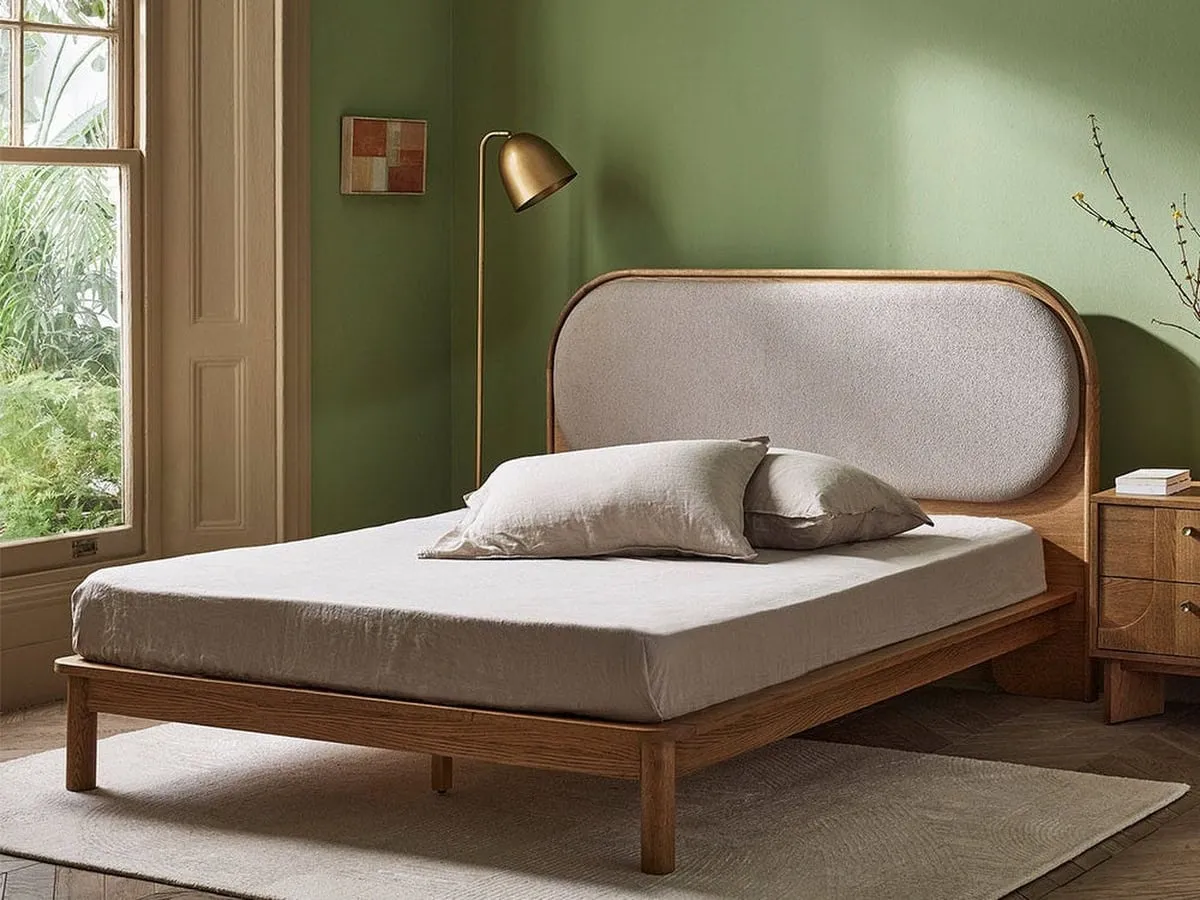 Wooden bed frame with fabric cushioned headboard
