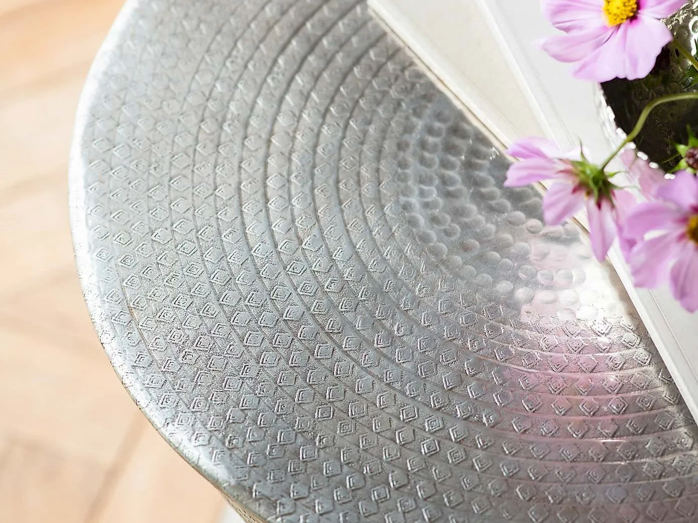 Round metal table with antique silver hammered finish