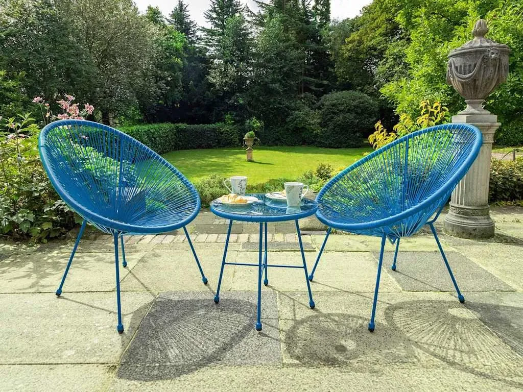 Pair of blue rattan garden chairs and a matching table