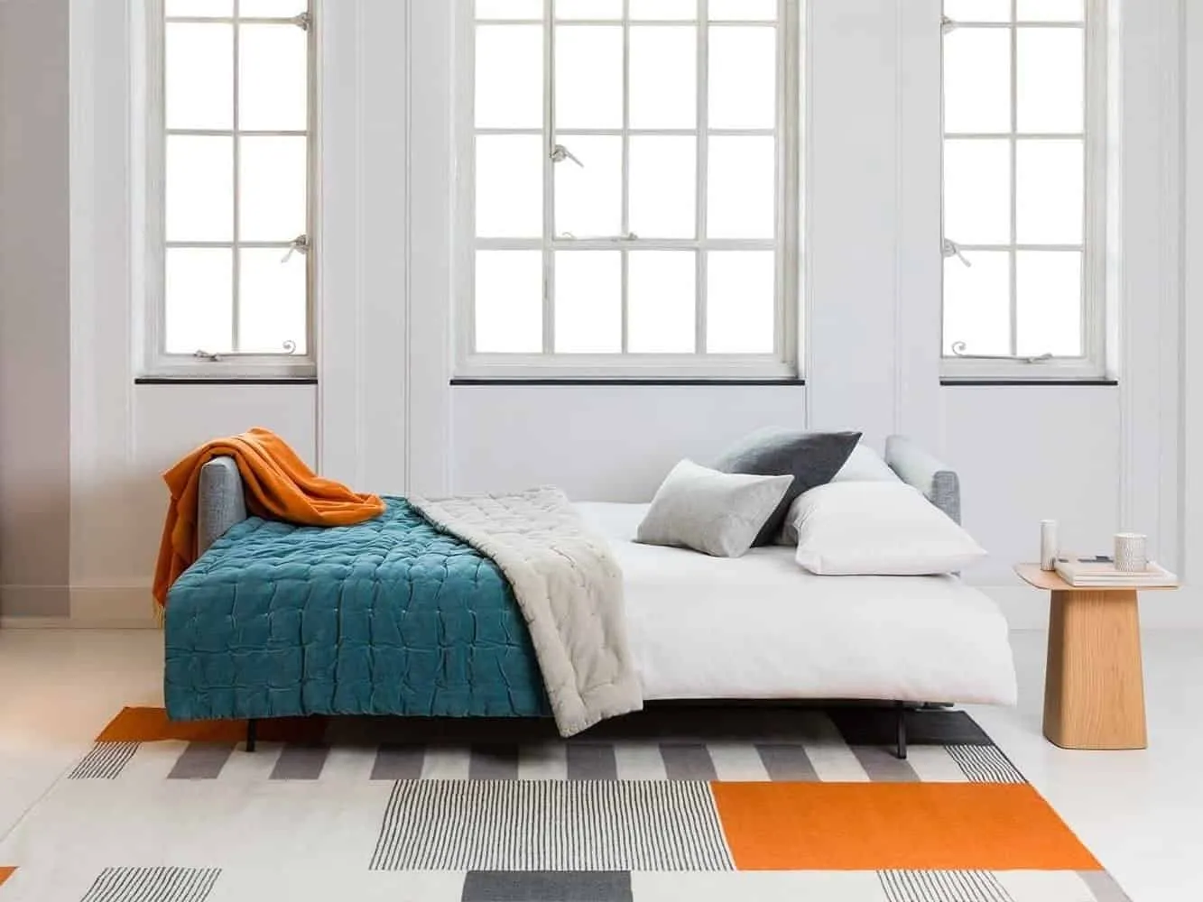 Sofa bed with bedding