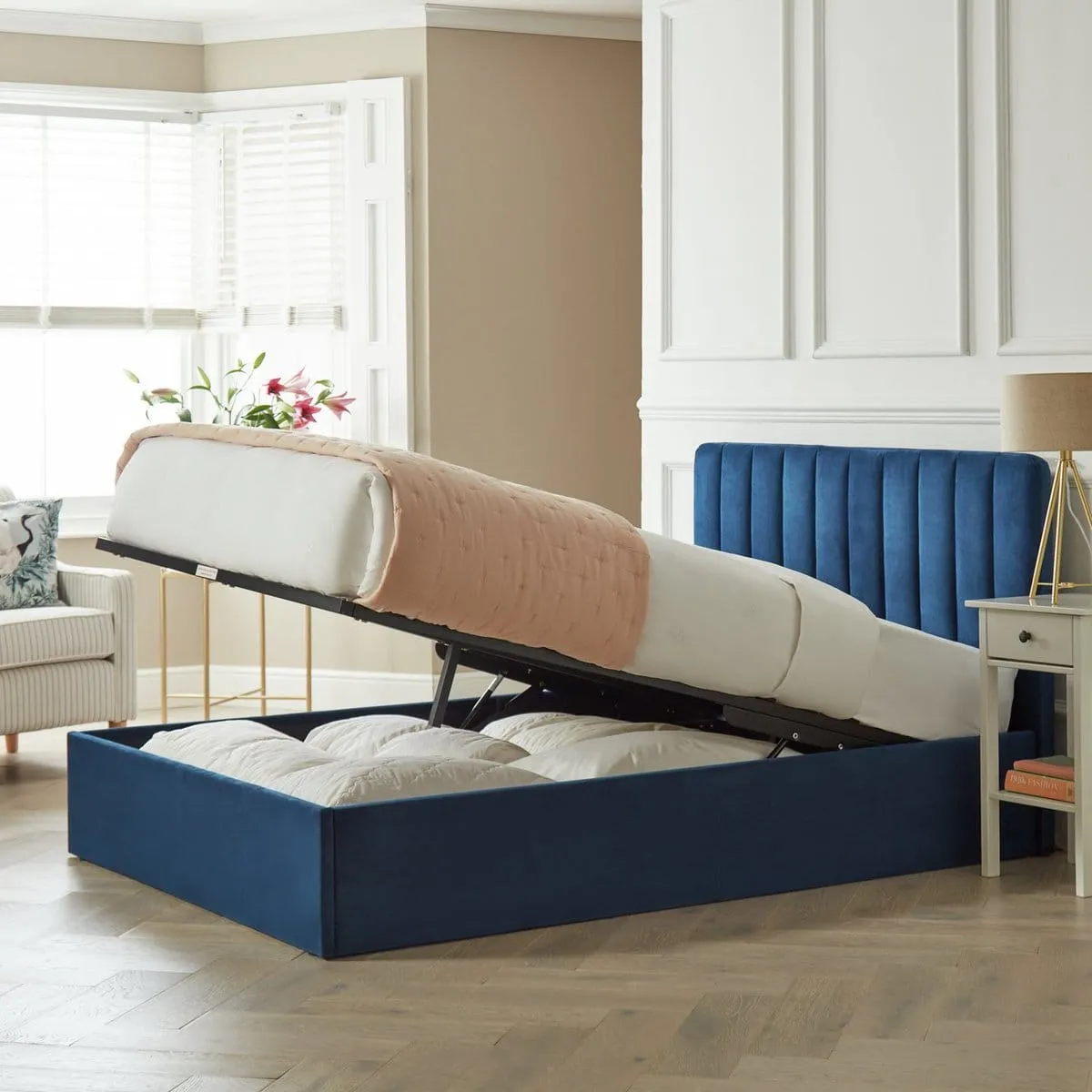 Navy velvet upholstered storage bed