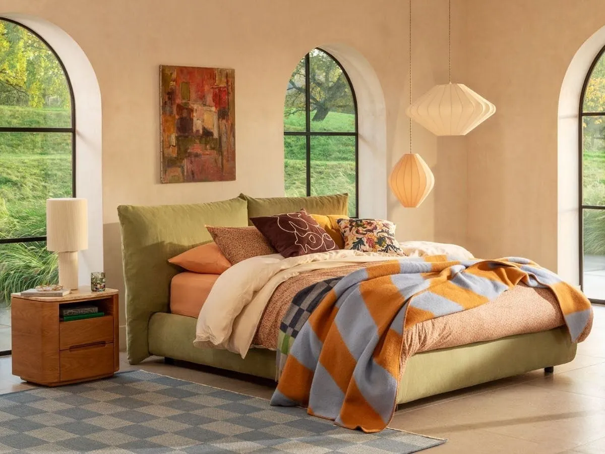 Fabric upholstered storage bed with pillow-style headboard