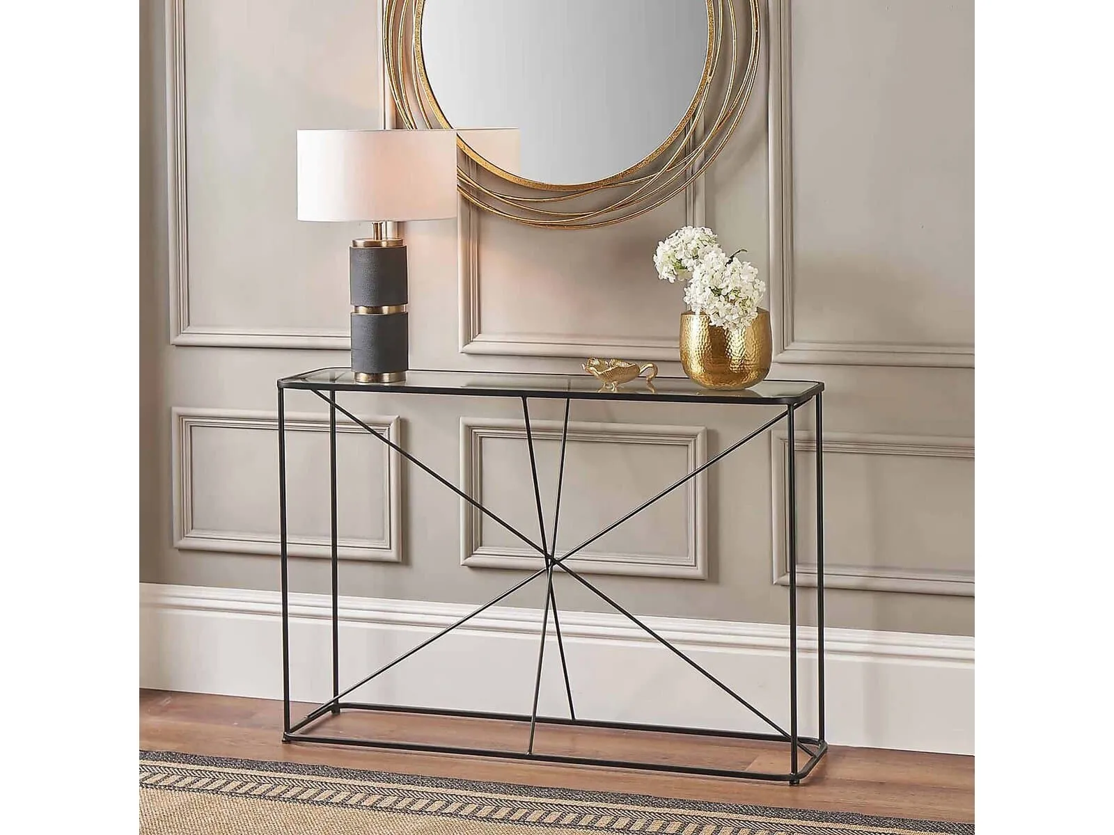 Console table with black metal frame and glass top