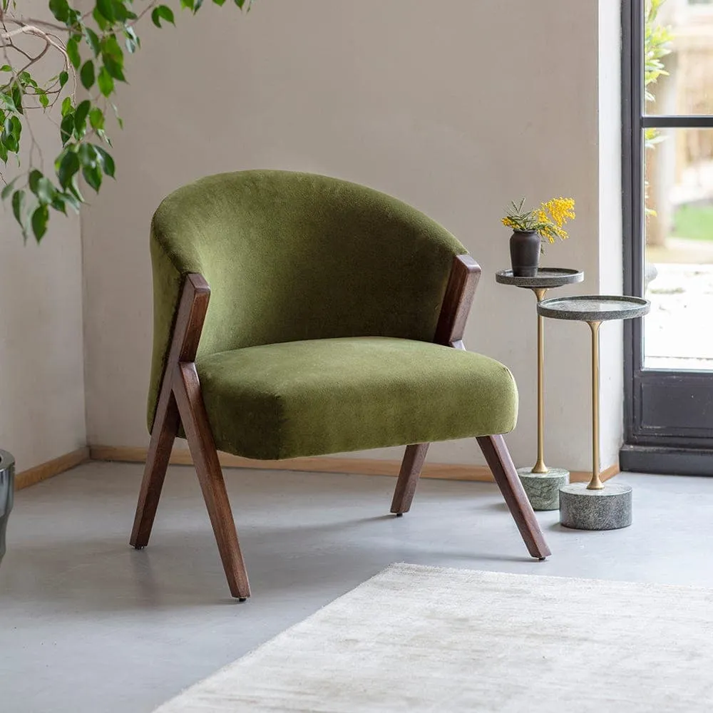 Green velvet curved back chair