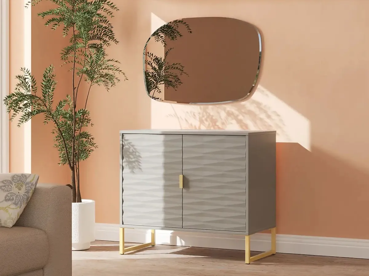 Grey sidebaoard with textured doors and brass-coloured stand