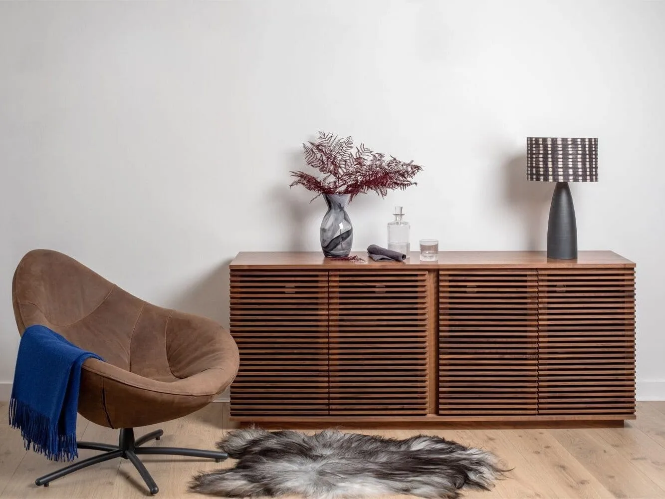 Wide walnut sideboard with slatted doors