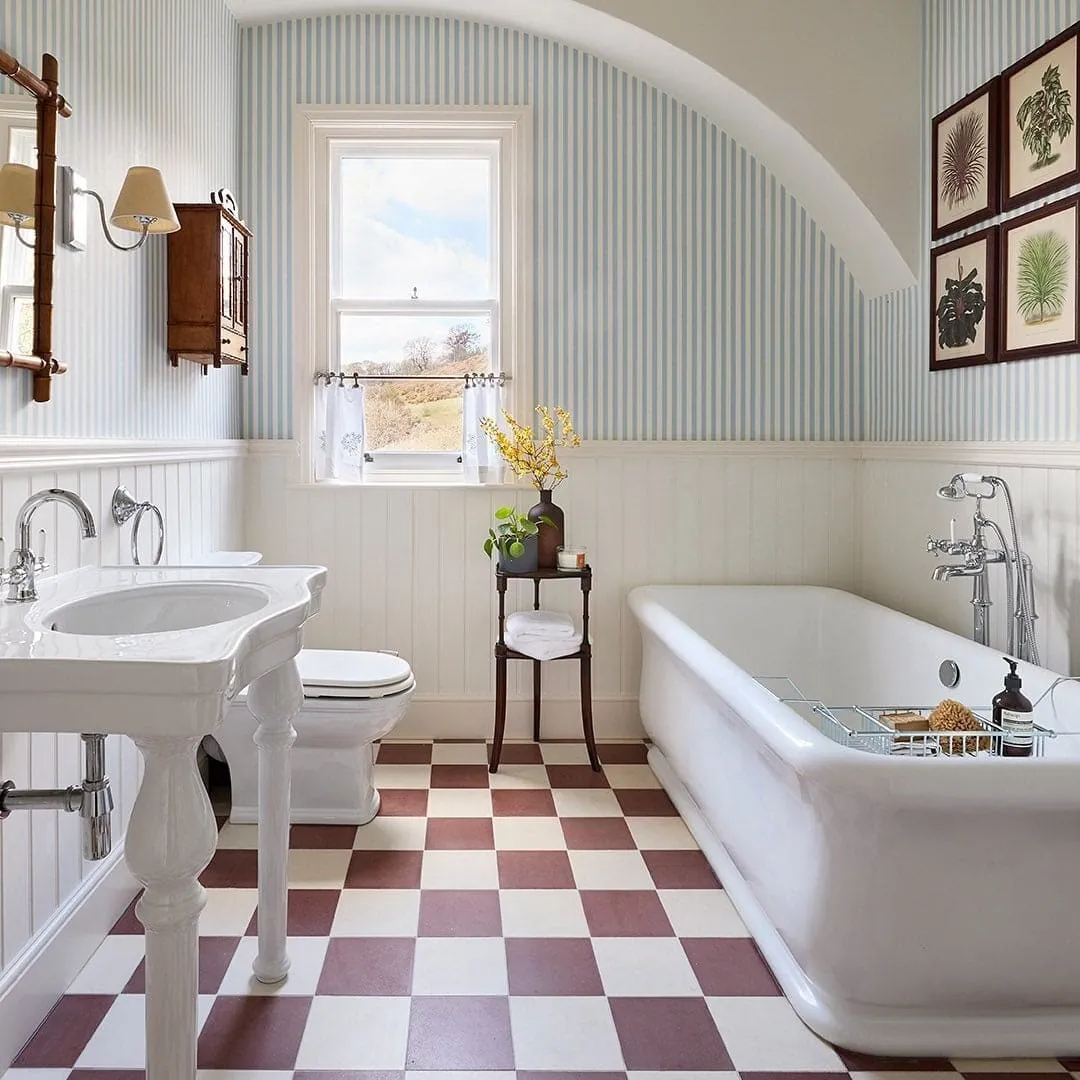 White bathroom with blue stripe wallpaper
