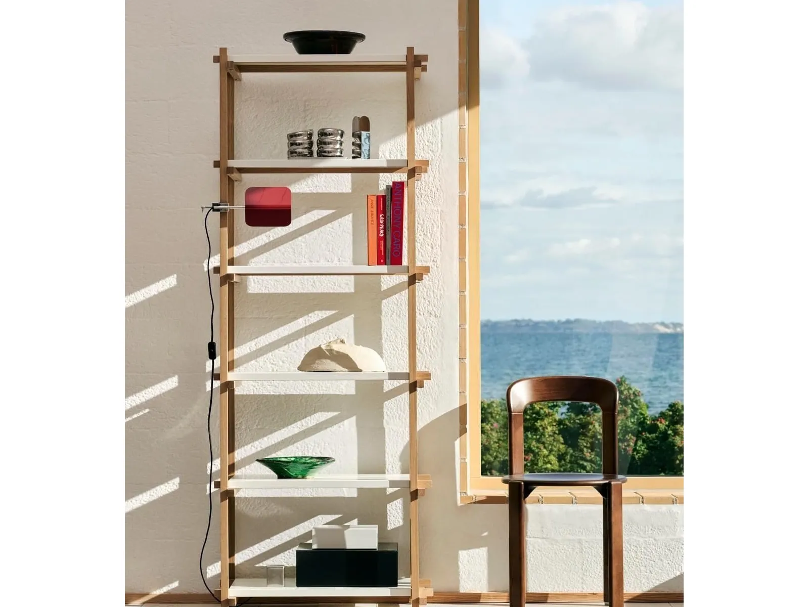 Tall wood and metal shelving unit