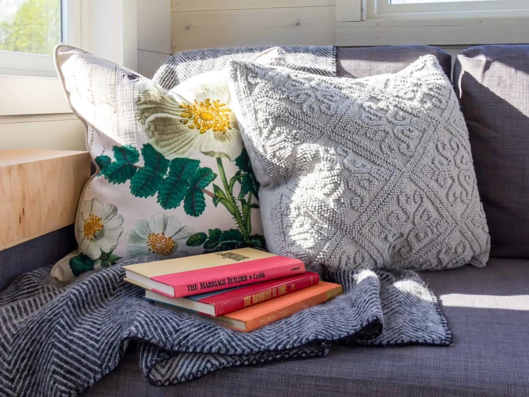 Cushions, books and a throw
