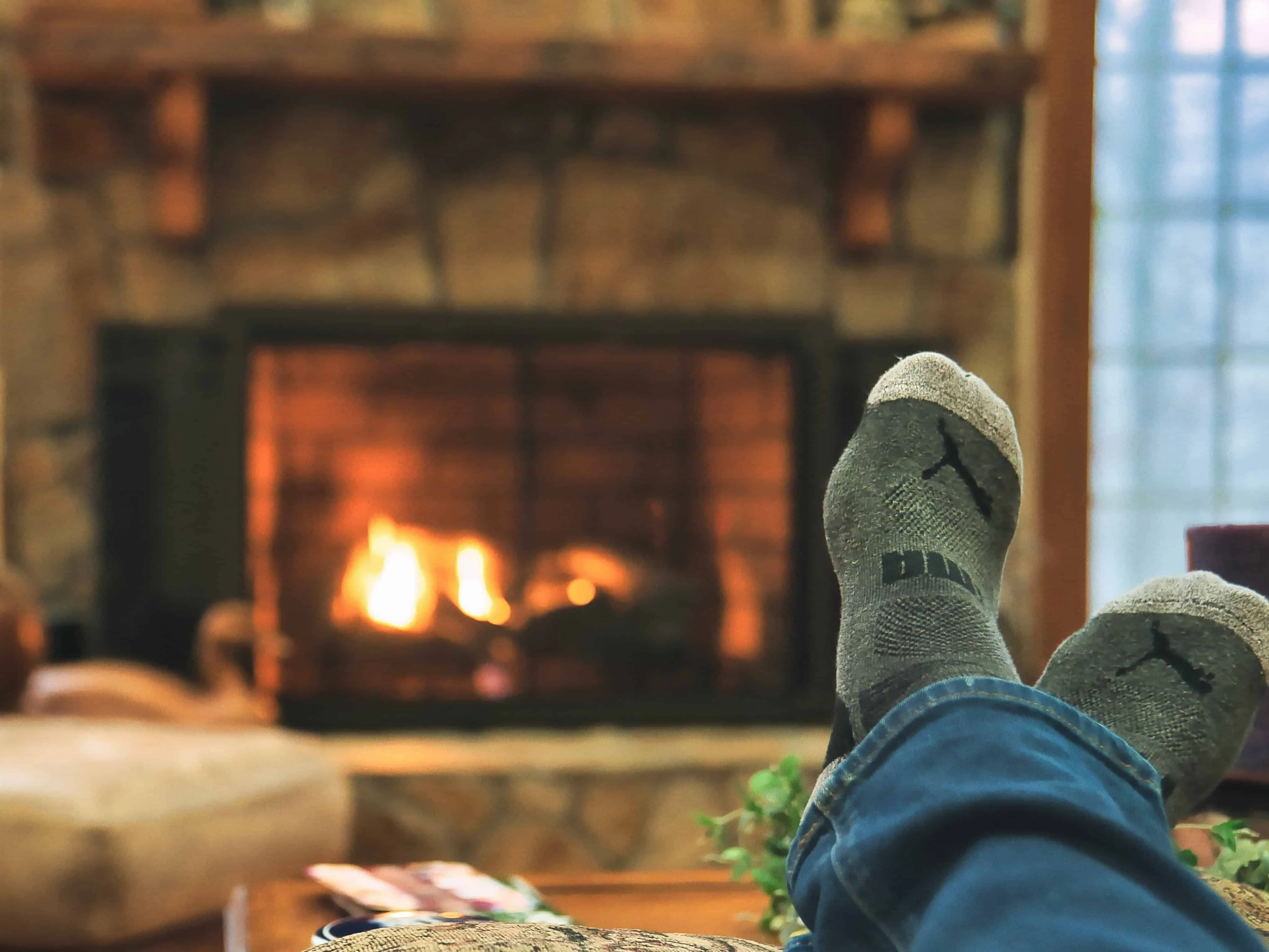 Warming feet beside the fireplace