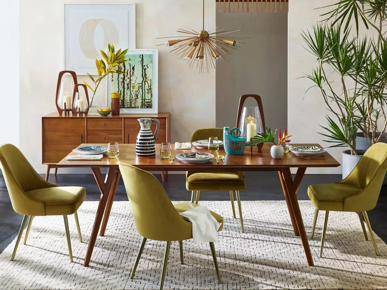 Mid century-style dining table and green velvet chairs