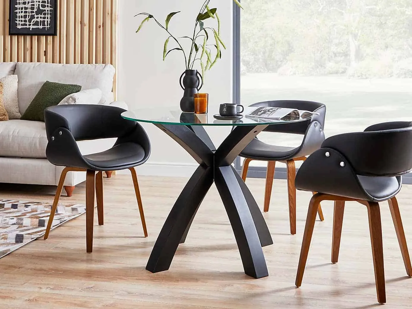 x-frame dining table with round glass top