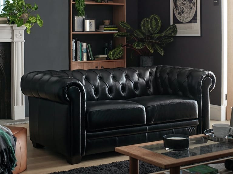 2-seater black leather Chesterfield