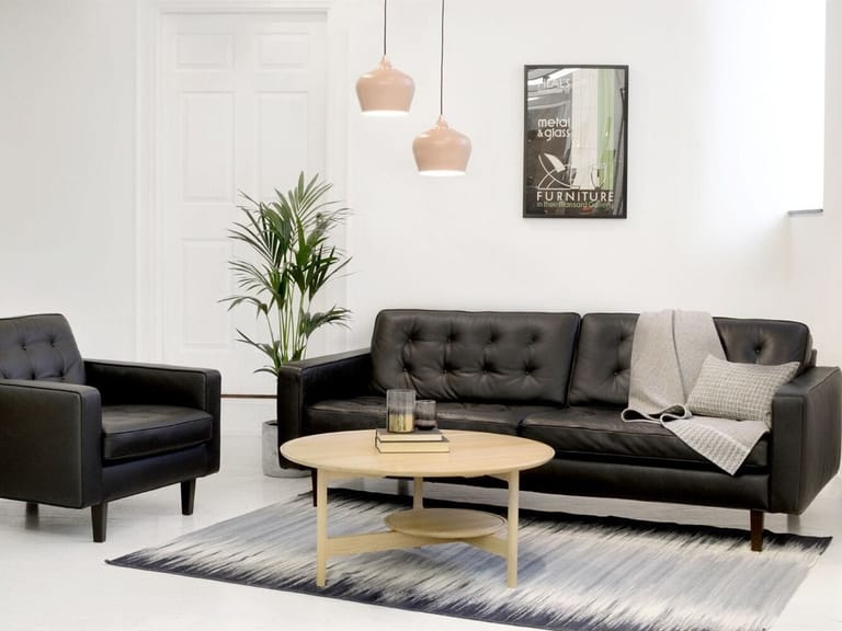 Black leather sofa and matching armchair
