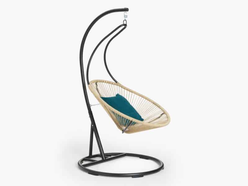 Natural woven hanging chair with a black metal base