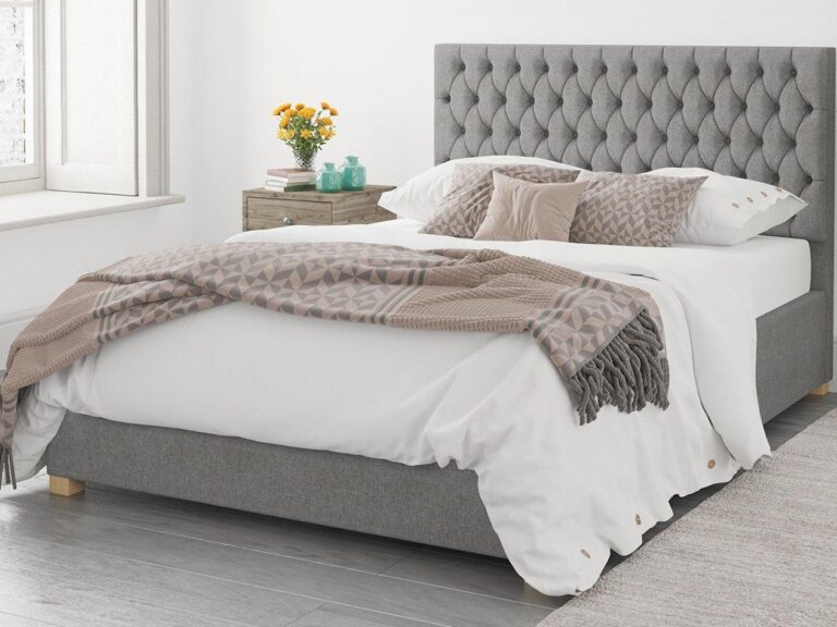 Grey fabric bed frame with buttoned headboard and storage base