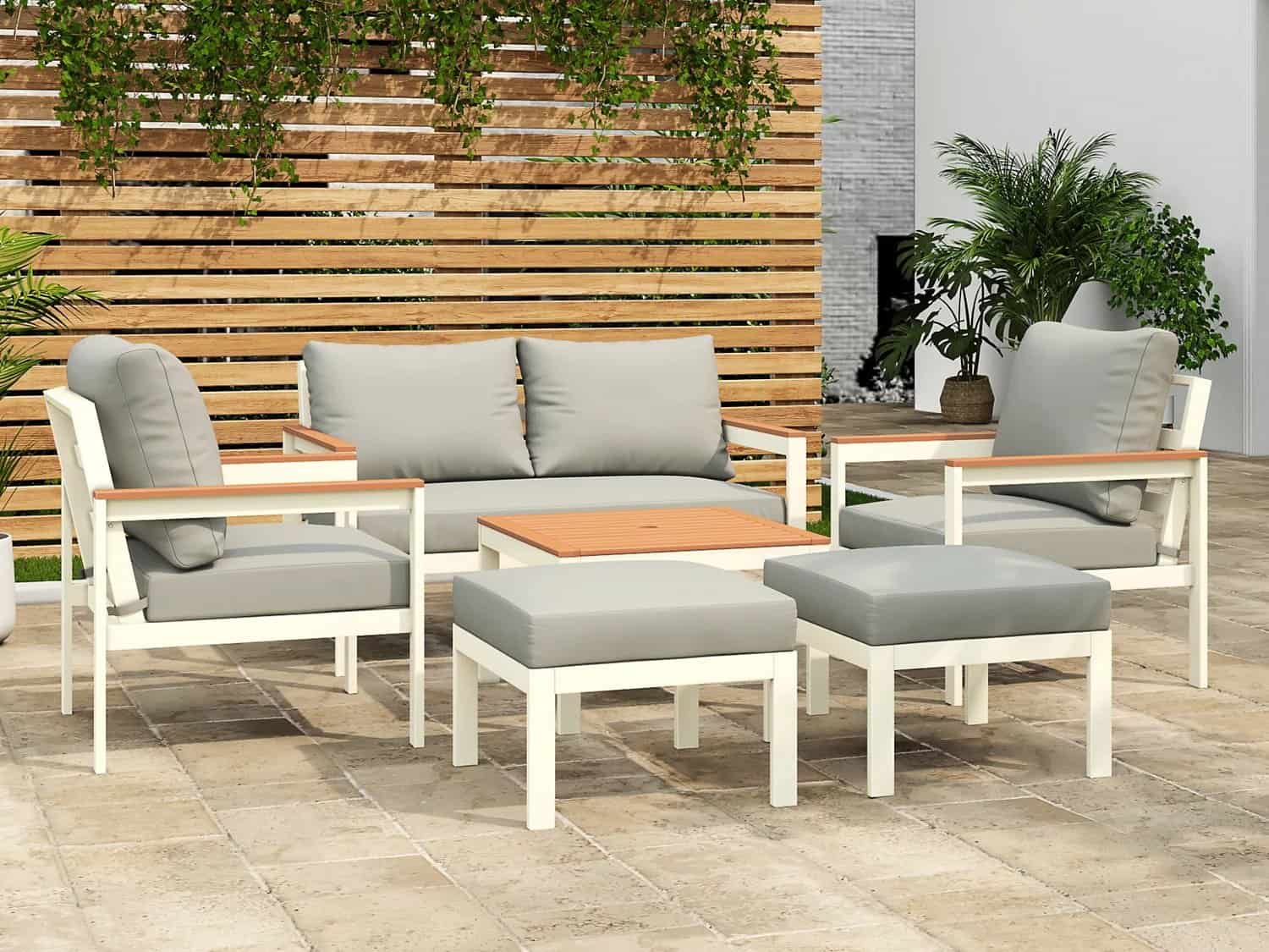 White and grey outdoor sofa, chairs, stools and a coffee table